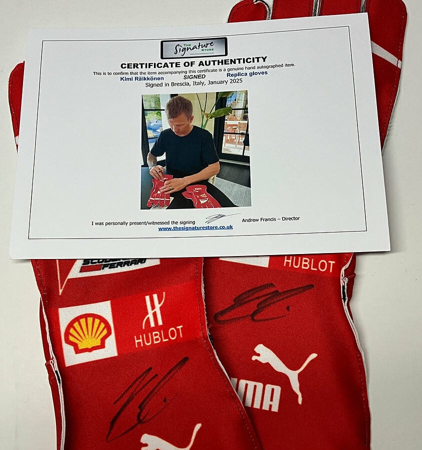 Kimi Räikkönen signed replica gloves (pair, both signed) from the Formula 1 Memorabilia store collection.