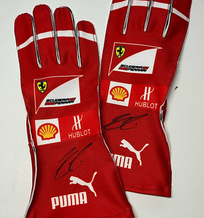 Kimi Räikkönen signed replica gloves (pair, both signed) from the Formula 1 Memorabilia store collection.